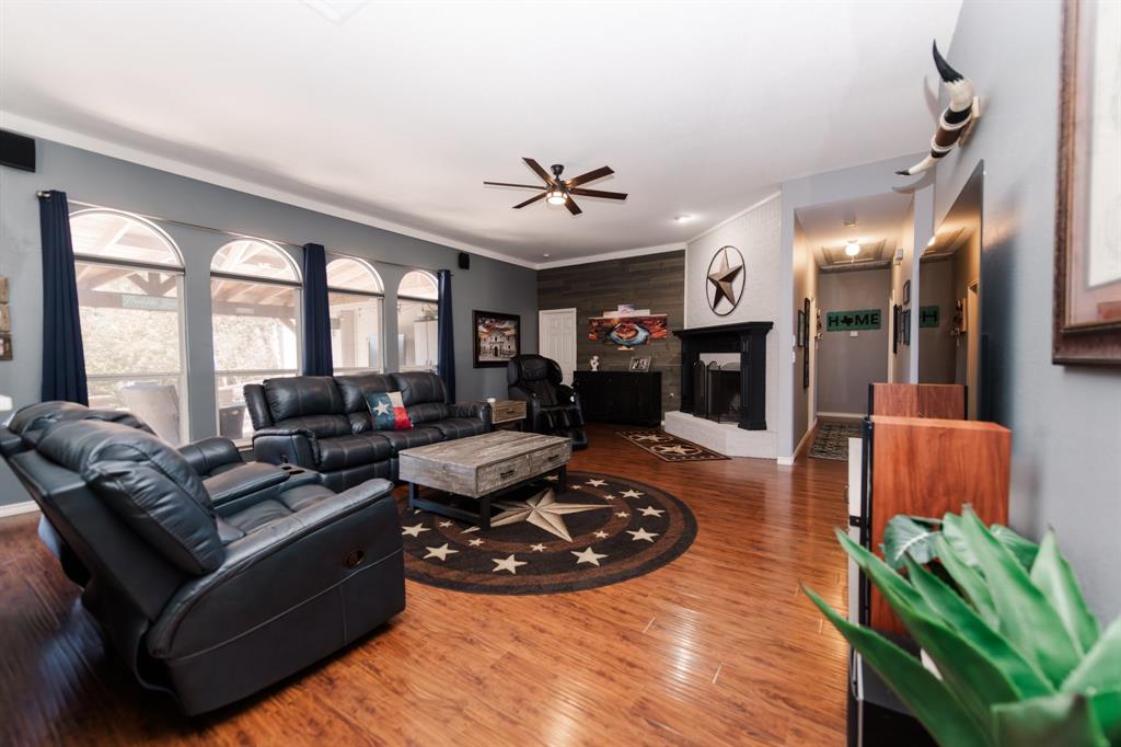 2107 Lacebark Lane Rockwall, TX 75087 - Photo 3 of 34 a living room with furniture rug and a fireplace