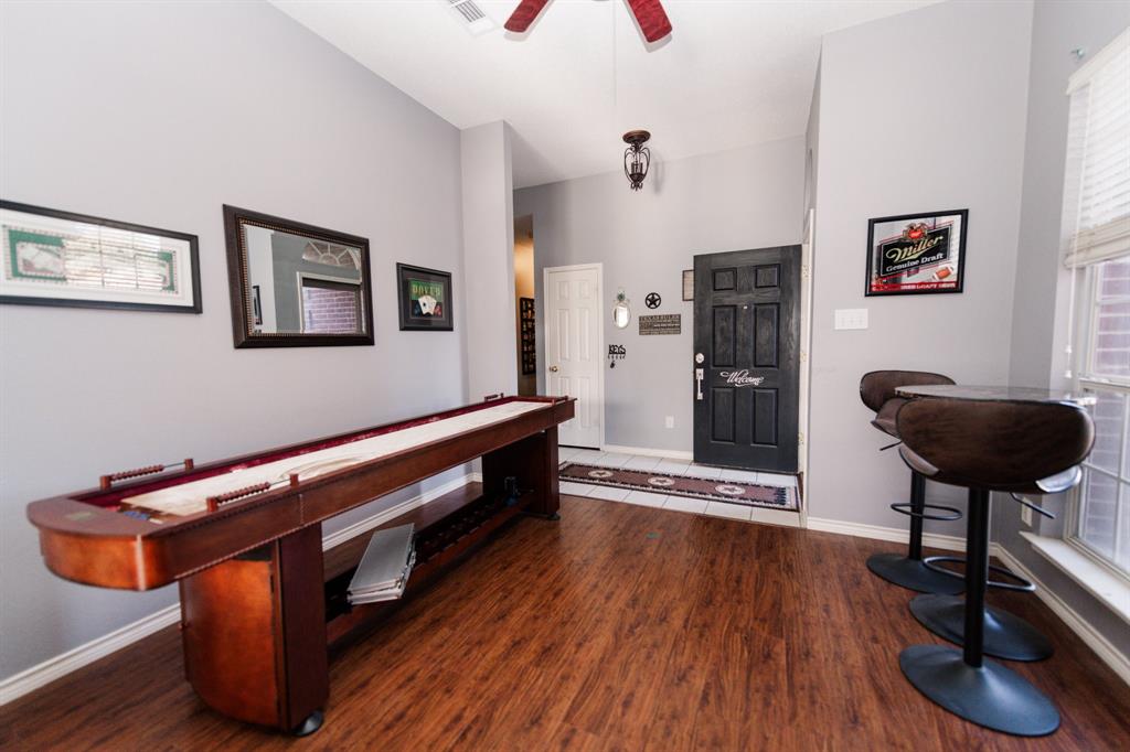 2107 Lacebark Lane Rockwall, TX 75087 - Photo 4 of 34 a room with furniture and wooden floor