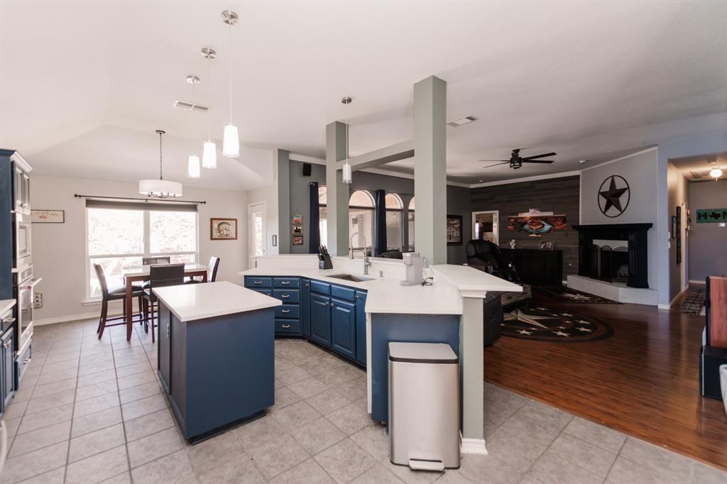 2107 Lacebark Lane Rockwall, TX 75087 - Photo 8 of 34 a large kitchen with a table and chairs