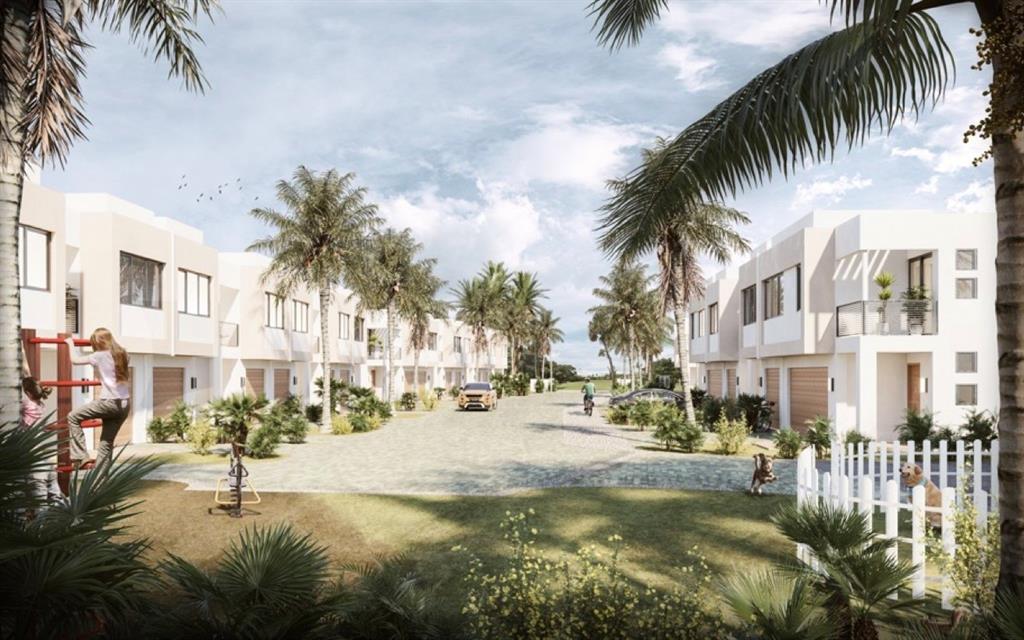 740 Cypress Grove Drive, Unit 740 Pompano Beach, FL 33069 - Photo 11 of 11 a view of residential houses with swimming pool and furniture