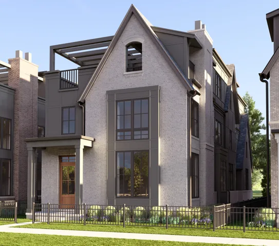 a view of a brick house with many windows and a yard