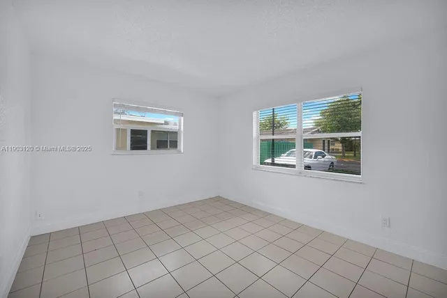 a view of a room that has a window in it