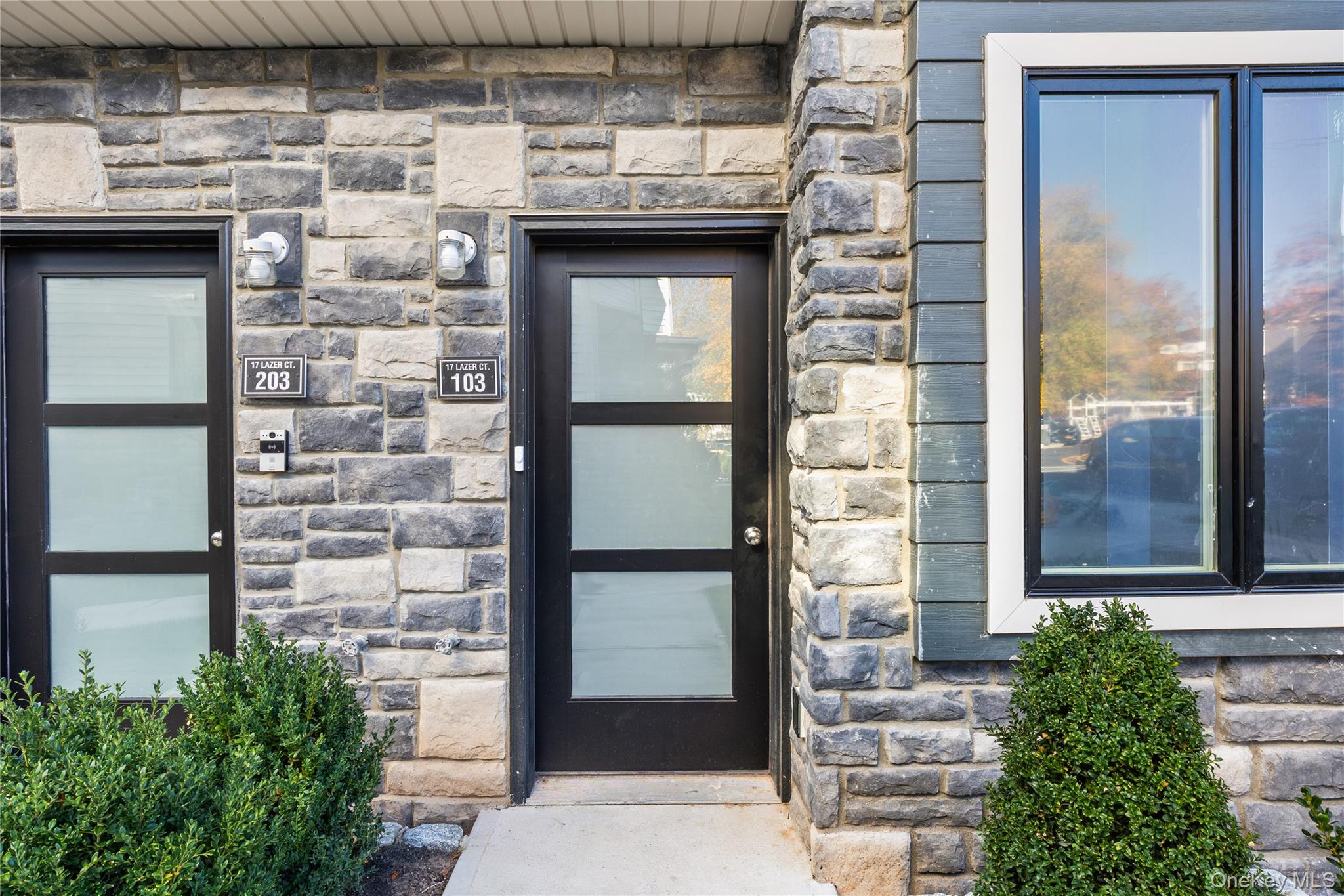 17 Lazer Court, Unit 102 Spring Valley, NY 10977 - Photo 2 of 31 Entrance to property featuring stone siding