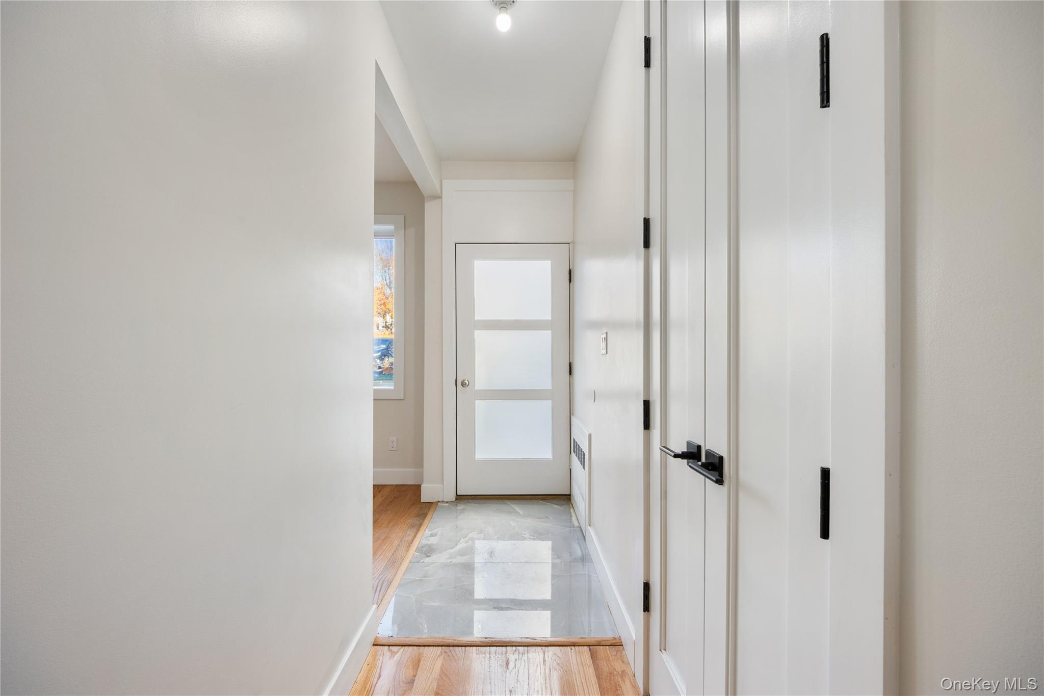 17 Lazer Court, Unit 102 Spring Valley, NY 10977 - Photo 5 of 31 Hall featuring light wood-type flooring and baseboards