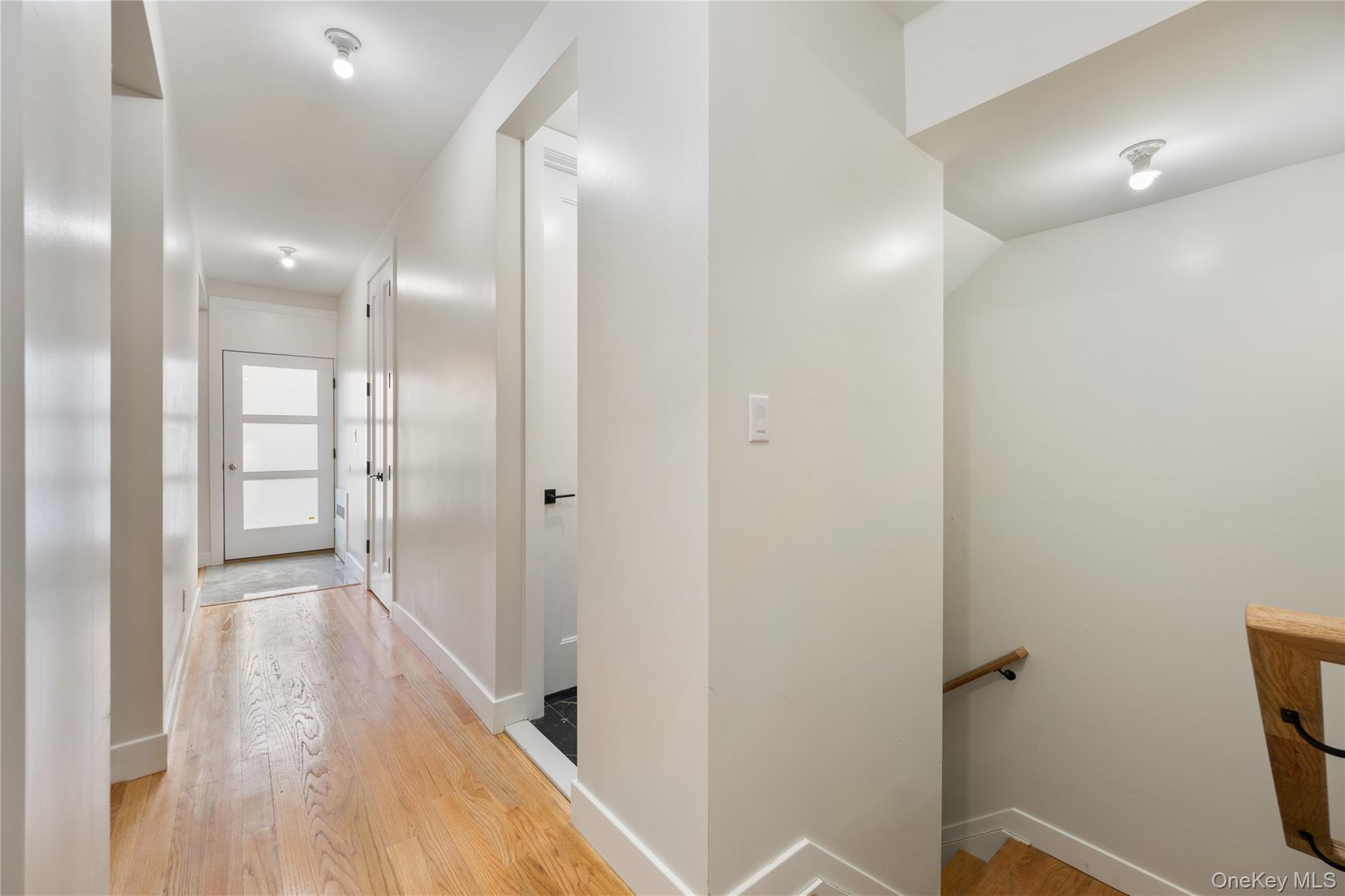 17 Lazer Court, Unit 102 Spring Valley, NY 10977 - Photo 7 of 31 Hallway featuring light wood finished floors and baseboards
