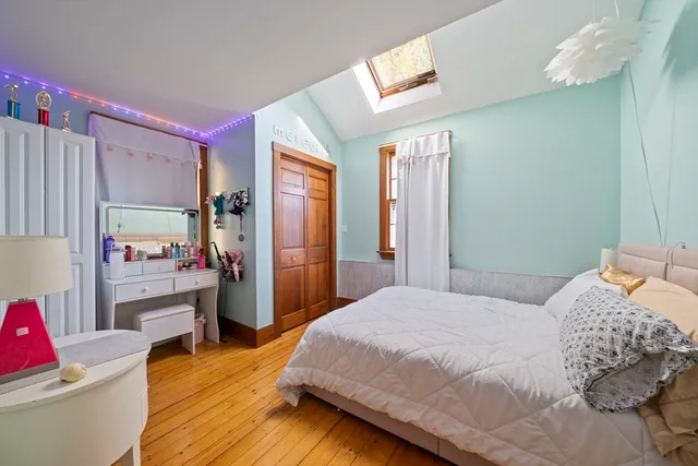 a bedroom with a bed and a couch