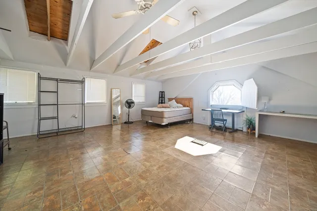 a view of a livingroom with a dishwasher and furniture