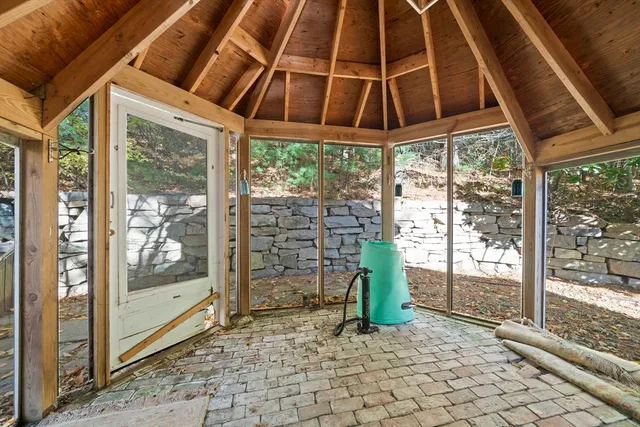 a view of a patio with table and chairs and potted plants