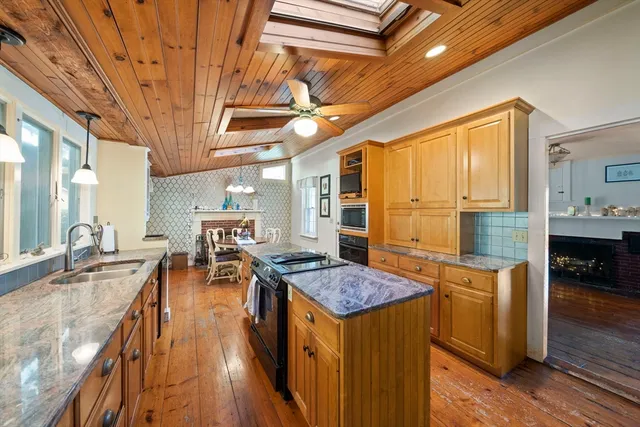 a very nice looking dining room with a large window