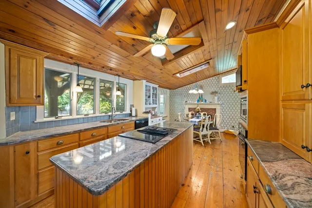a kitchen with granite countertop lots of counter top space and furniture