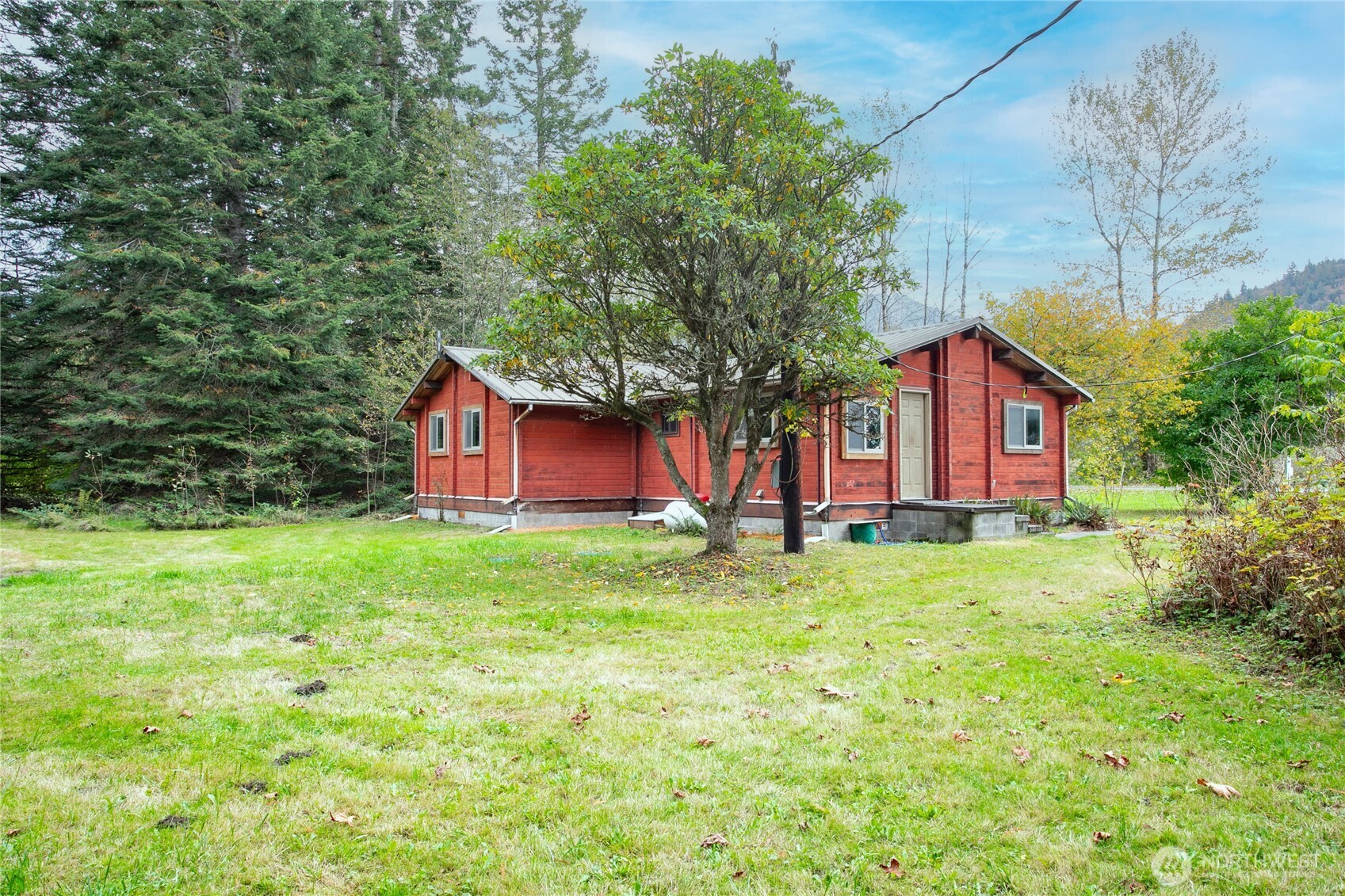 5950 Truck Road Deming, WA 98244 - Photo 3 of 23 a view of a house with backyard