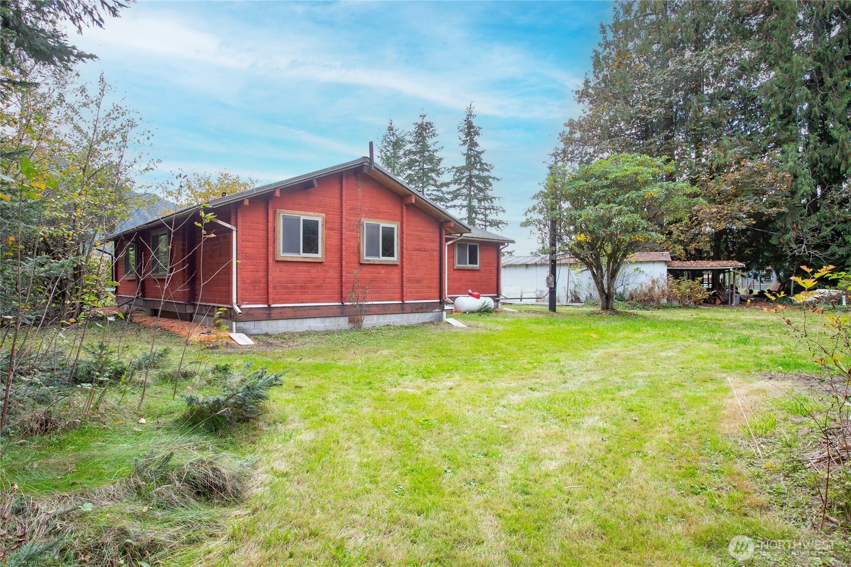5950 Truck Road Deming, WA 98244 - Photo 4 of 23 a view of a house with backyard and sitting area