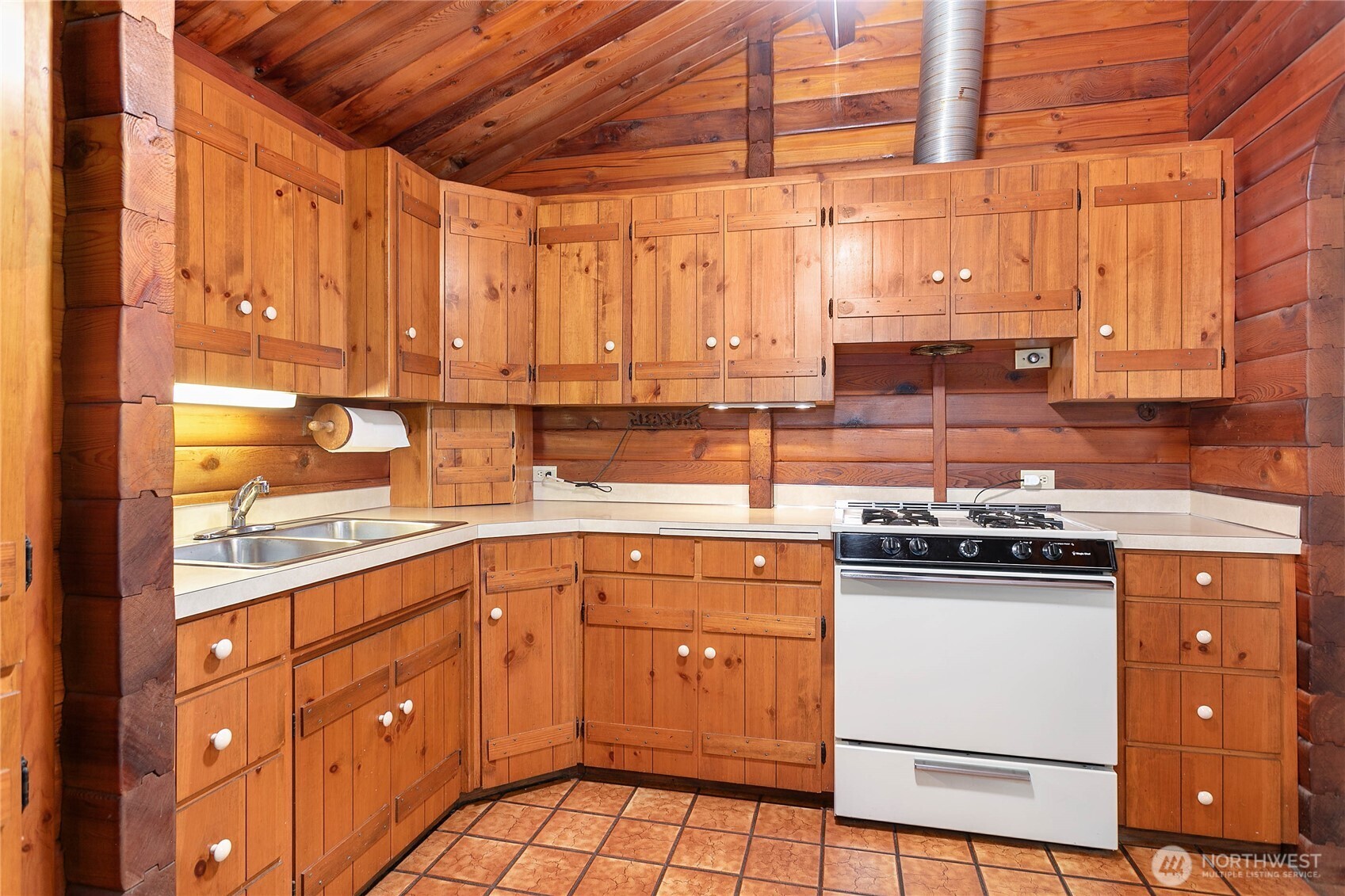 5950 Truck Road Deming, WA 98244 - Photo 10 of 23 a kitchen with a sink stove and cabinets