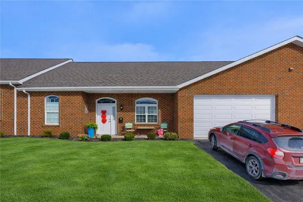 a front view of house with yard