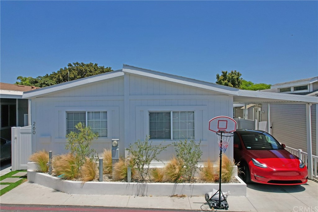 a front view of a house with parking