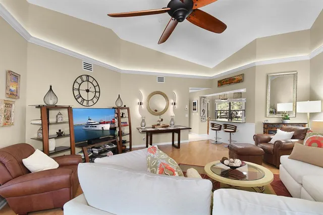 a living room with furniture window and wooden floor