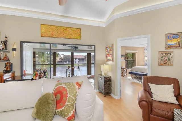a living room filled with furniture and a window