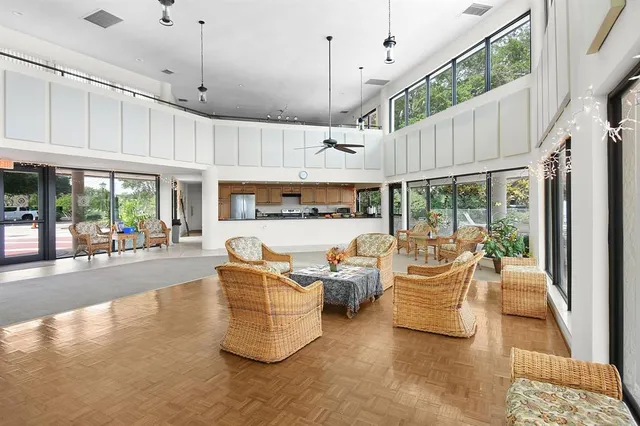 an aerial view of a houses with a lake