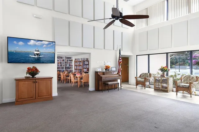 an aerial view of a house with swimming pool and outdoor space