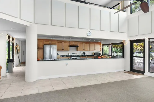 an aerial view of a house with a yard