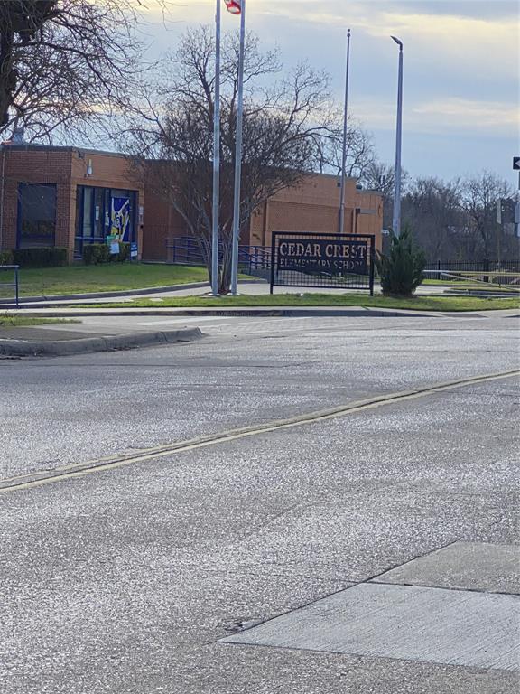 815 Bonnie View Road Dallas, TX 75203 - Photo 27 of 29 View of asphalt street featuring street lights, curbs, and sidewalks