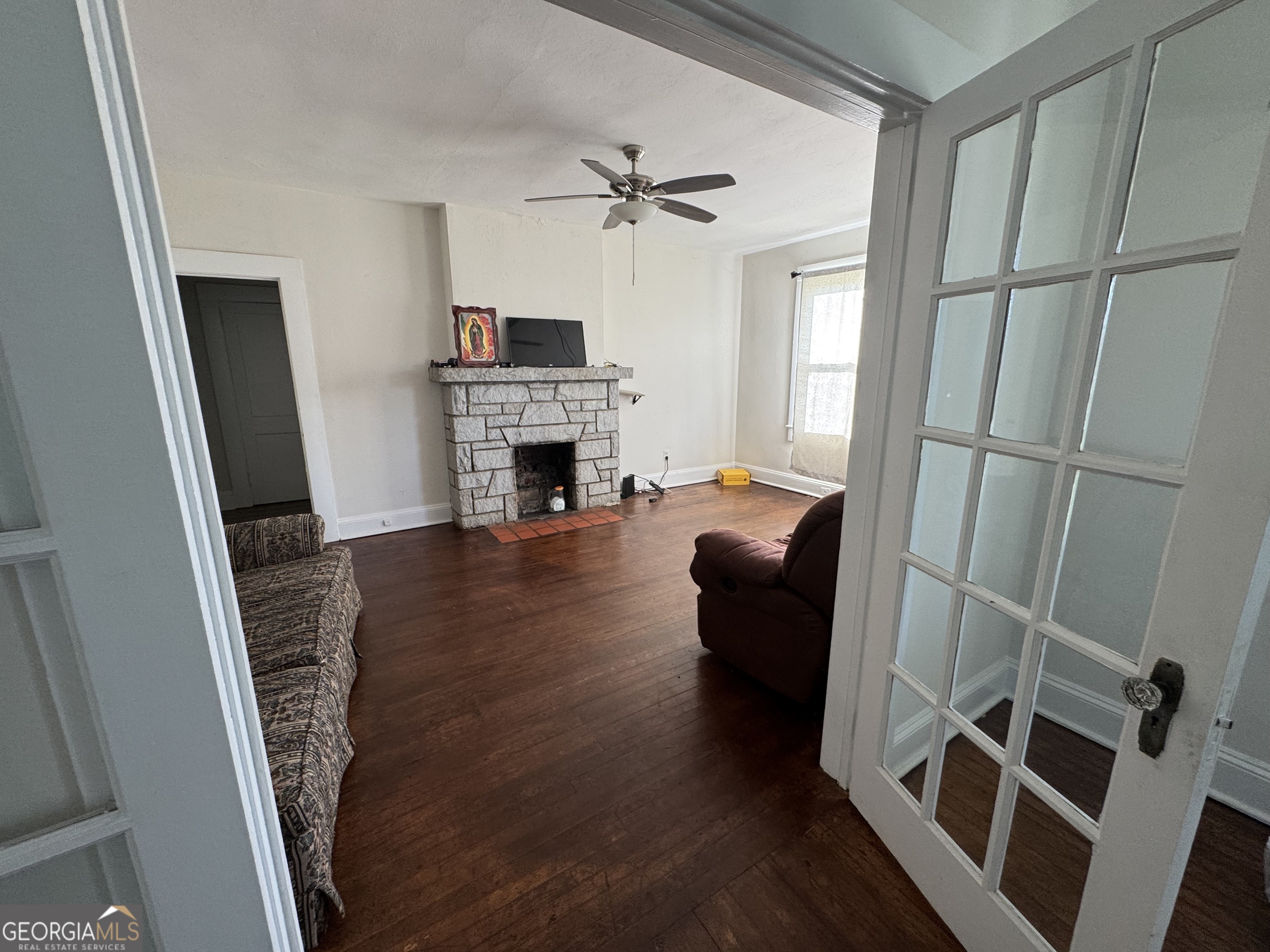 968 Elbert Street Elberton, GA 30635 - Photo 10 of 10 a living room with furniture and a fireplace