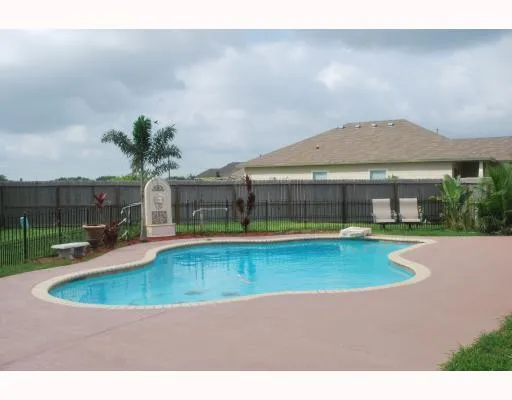 a view of a house with a swimming pool