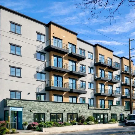 a bricked building with multiple windows and entryway