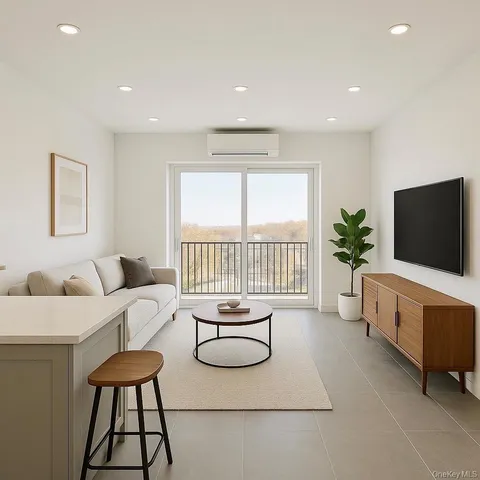 a living room with furniture a flat screen tv and a floor to ceiling window