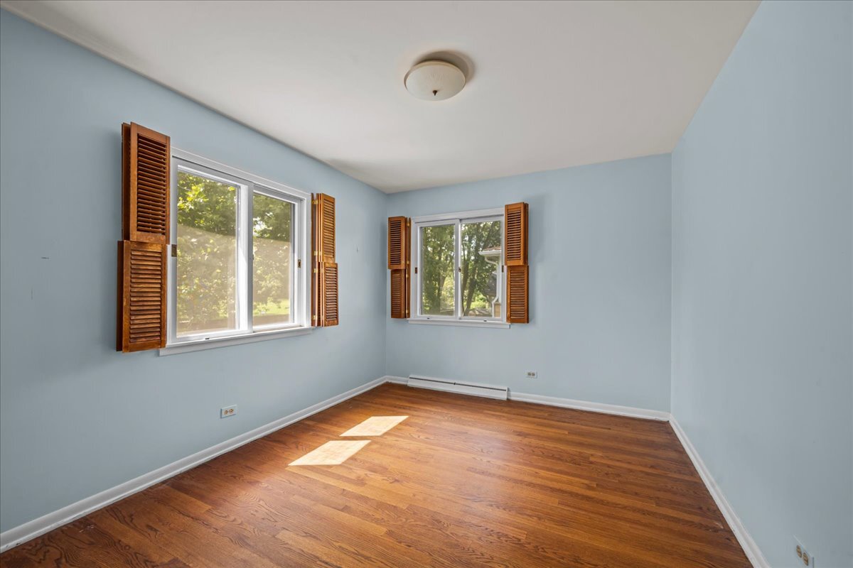 1505 Hackberry Road Deerfield, IL 60015 - Photo 14 of 19 a view of empty room with wooden floor and fan