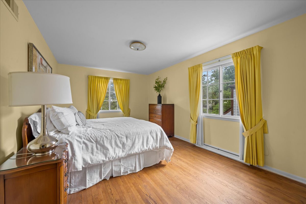 1505 Hackberry Road Deerfield, IL 60015 - Photo 9 of 19 a bedroom with a bed and wooden floor