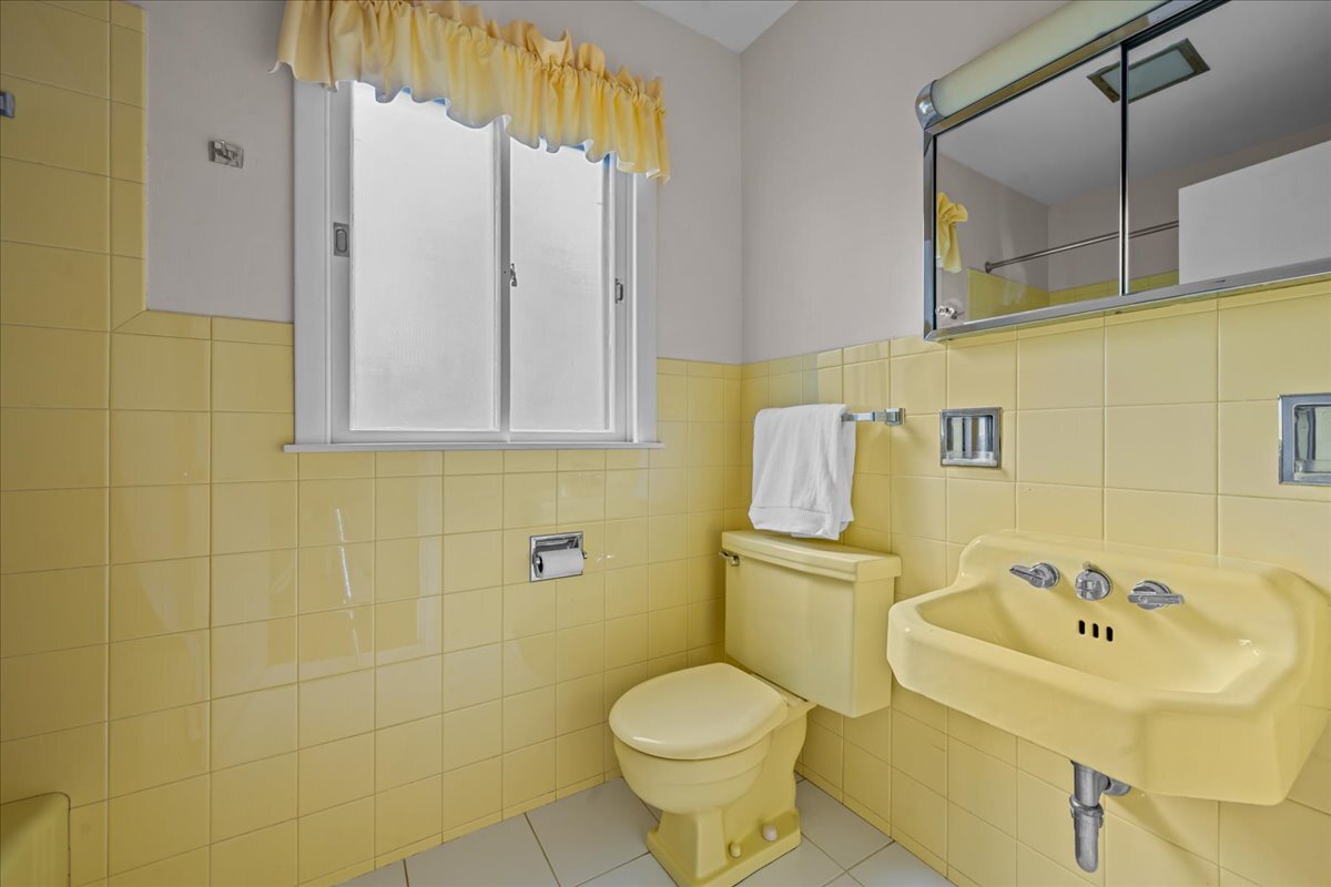1505 Hackberry Road Deerfield, IL 60015 - Photo 10 of 19 a bathroom with a sink and mirror with toilet