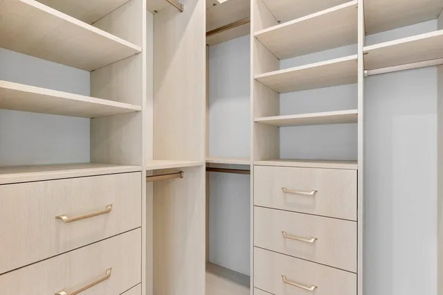 a bathroom with a granite countertop sink toilet and a mirror