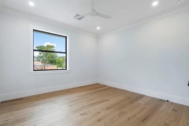 a balcony with furniture and a potted plant