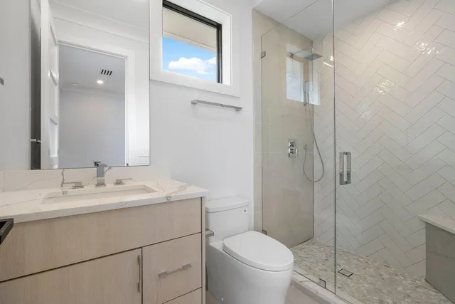 a view of a patio with couches and potted plants