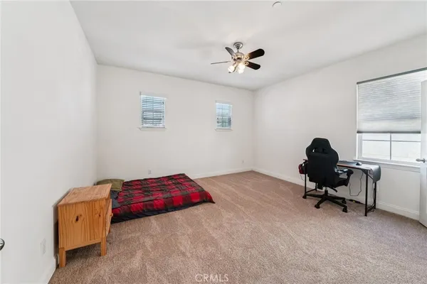 a bedroom with a workspace
