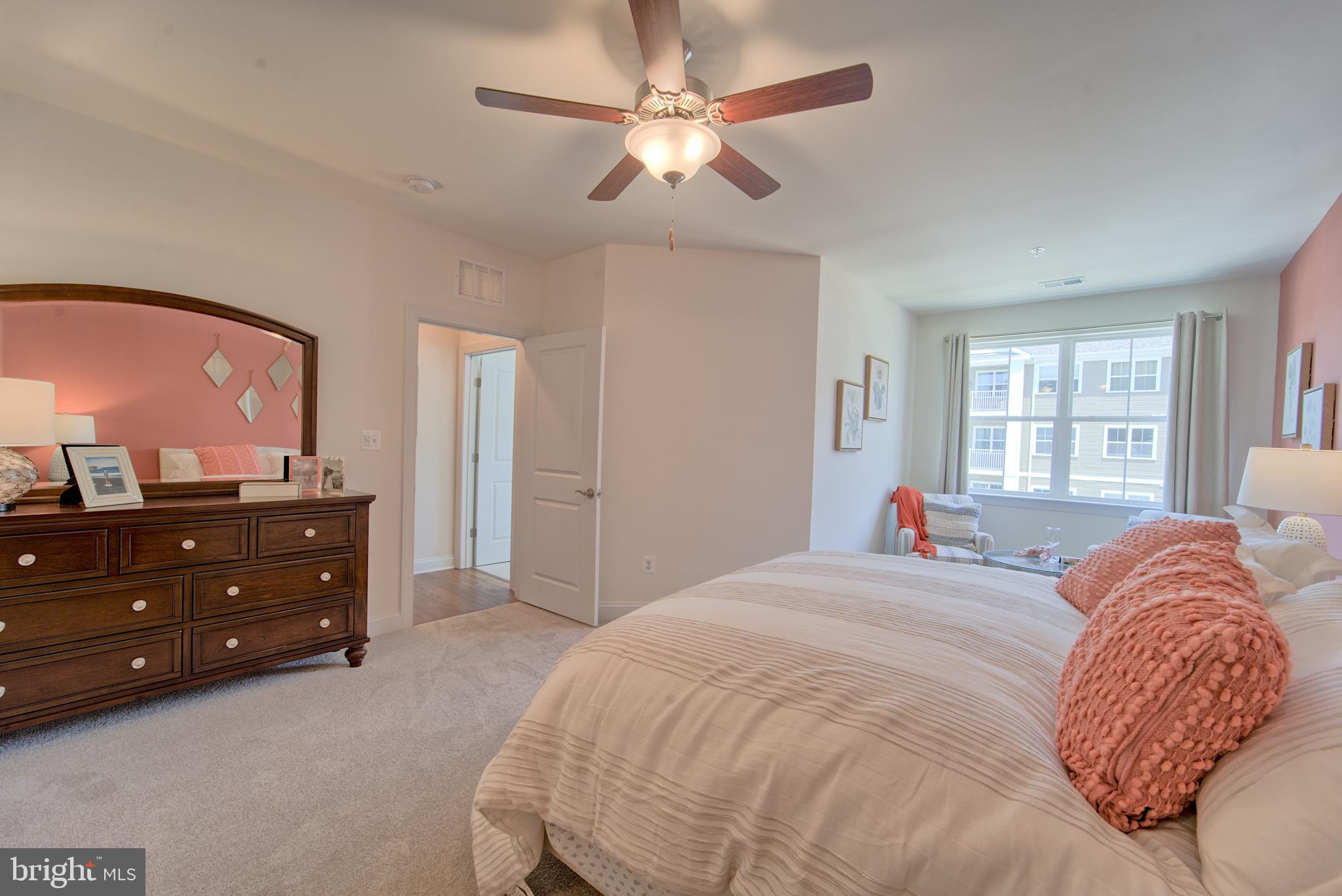 404 Bold Ruler Court, Unit 201 Havre de Grace, MD 21078 - Photo 16 of 43 a bedroom with a bed and a window