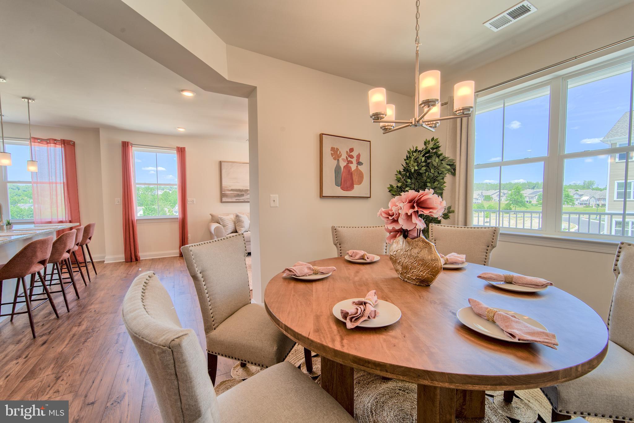 404 Bold Ruler Court, Unit 201 Havre de Grace, MD 21078 - Photo 19 of 43 a view of a dining room with furniture window and wooden floor