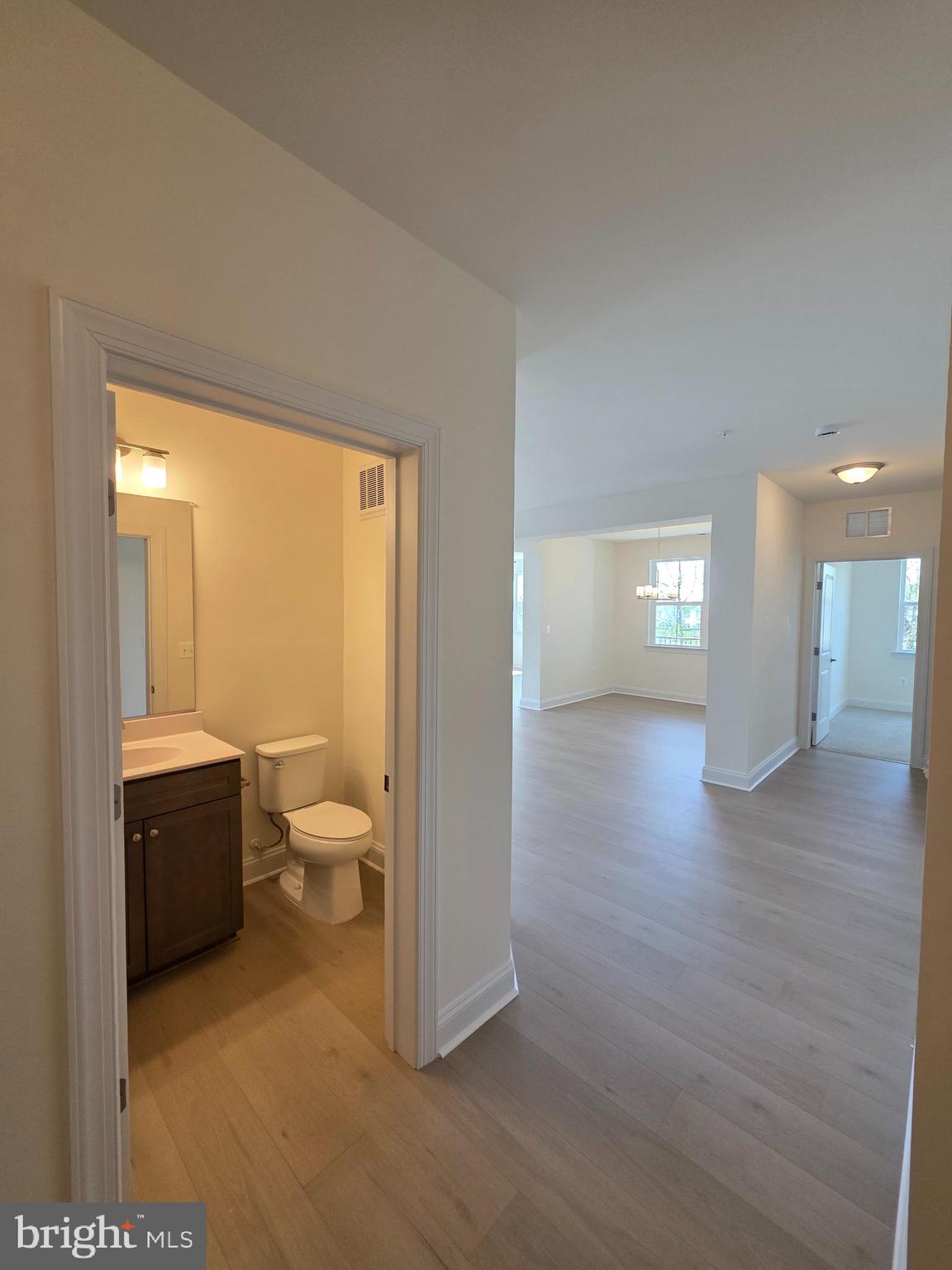 404 Bold Ruler Court, Unit 201 Havre de Grace, MD 21078 - Photo 24 of 43 a bathroom with a toilet sink and a mirror