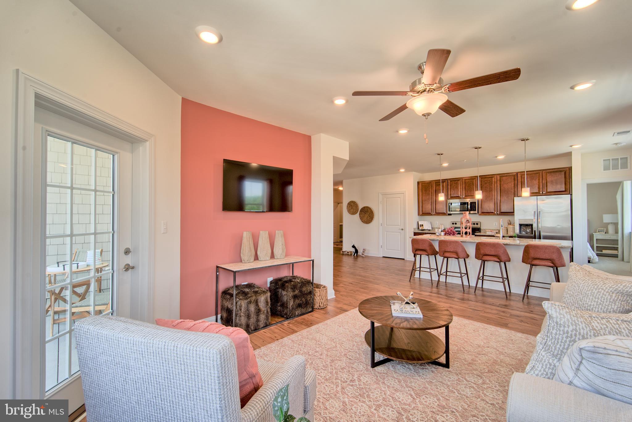 404 Bold Ruler Court, Unit 201 Havre de Grace, MD 21078 - Photo 3 of 43 a living room with furniture and a flat screen tv