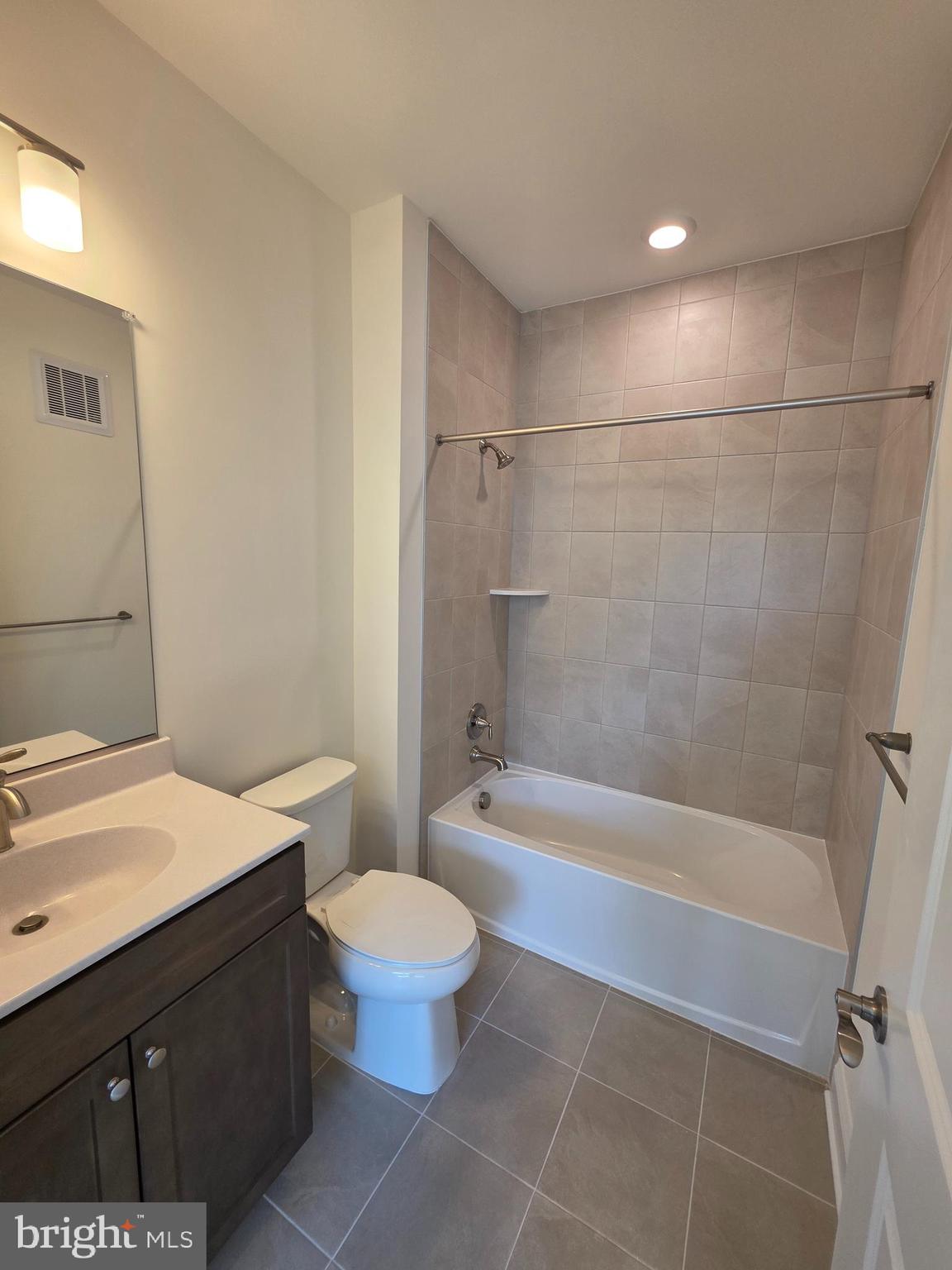 404 Bold Ruler Court, Unit 201 Havre de Grace, MD 21078 - Photo 31 of 43 a bathroom with a sink a toilet and shower