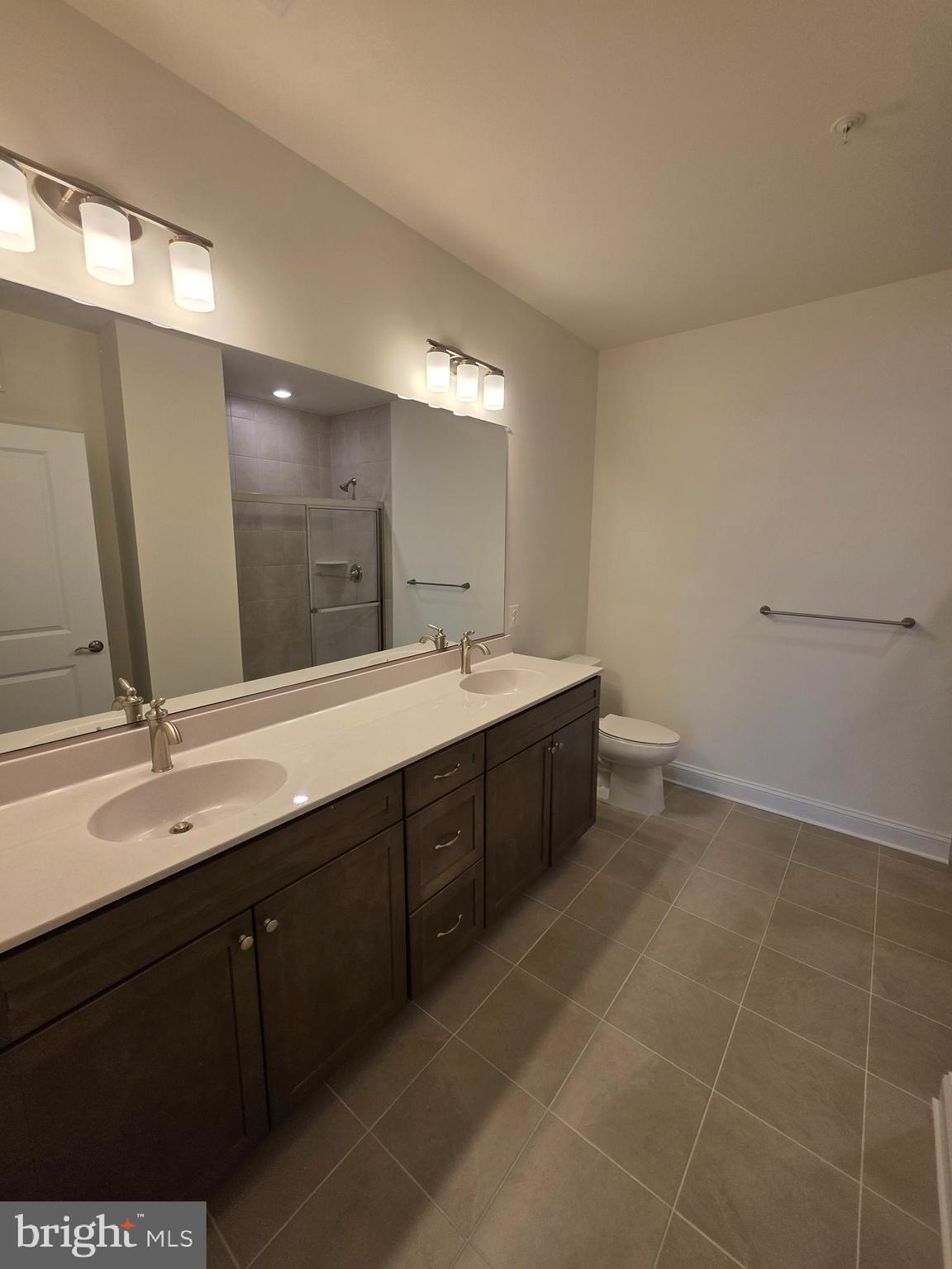 404 Bold Ruler Court, Unit 201 Havre de Grace, MD 21078 - Photo 38 of 43 a bathroom with a double vanity sink mirror and