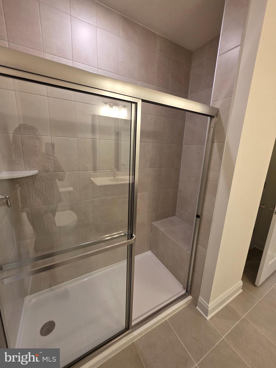 404 Bold Ruler Court, Unit 201 Havre de Grace, MD 21078 - Photo 40 of 43 a bathroom with a glass shower door