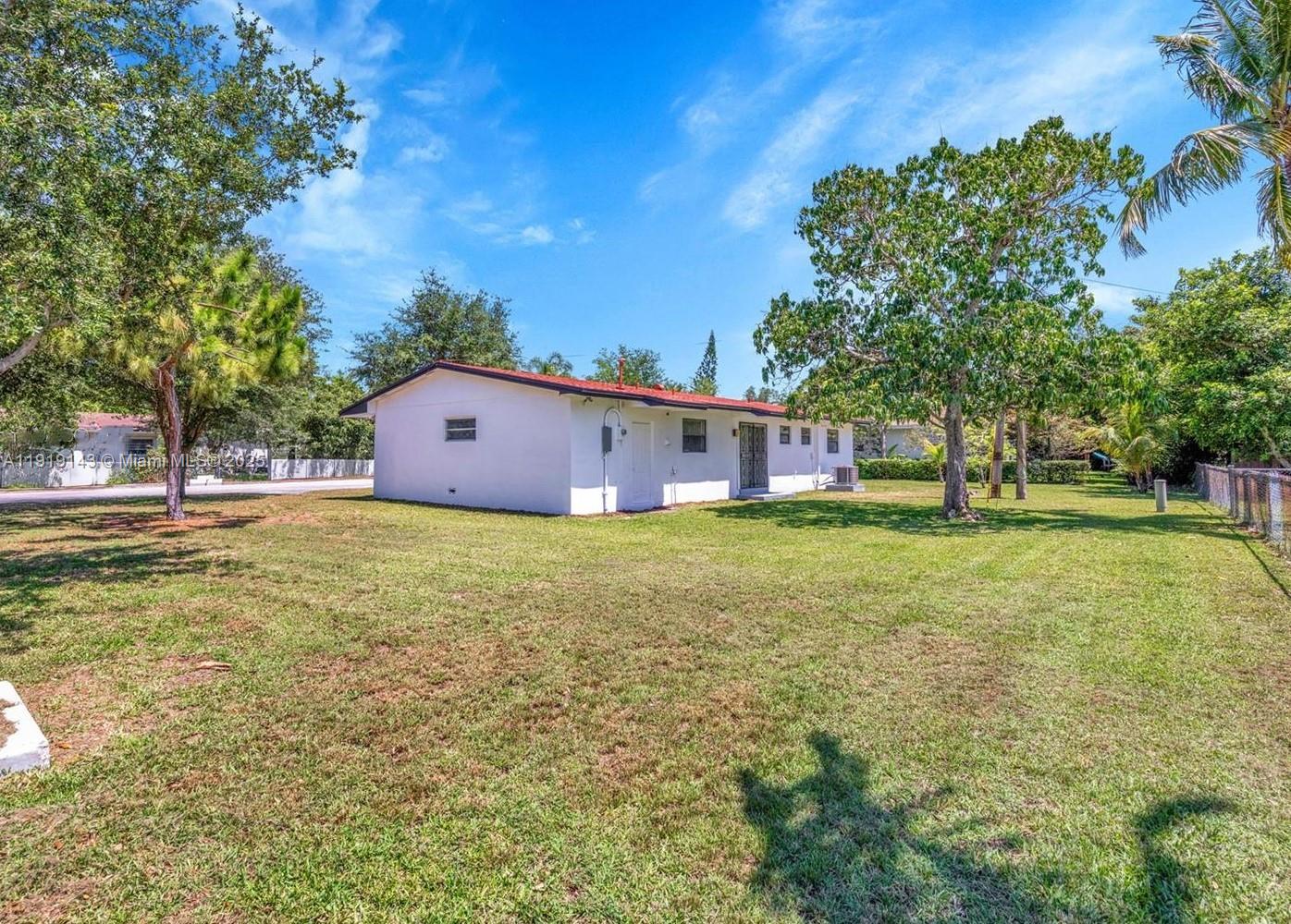 6250 Southwest 58th Place, Unit 1 South Miami, FL 33143 - Photo 13 of 13 a front view of a house with garden