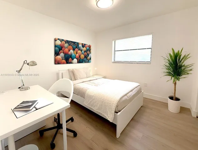 a bedroom with a bed and a table