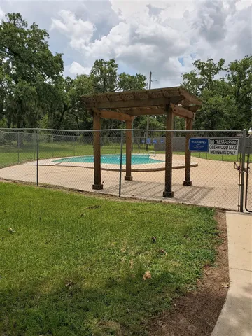 a view of a park with large trees