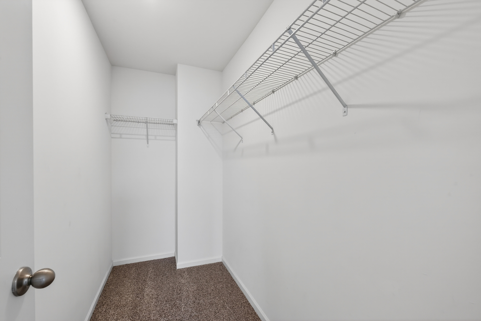 3831 Currant Lane Elgin, IL 60124 - Photo 17 of 25 a view of a room with racks on the wall