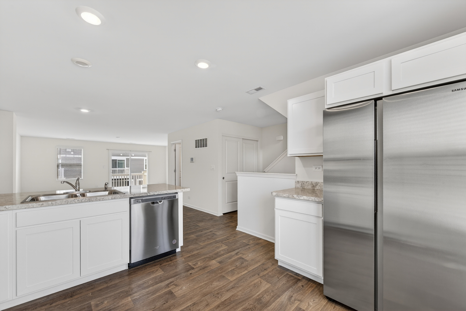 3831 Currant Lane Elgin, IL 60124 - Photo 5 of 25 a kitchen with a sink stainless steel appliances and cabinets