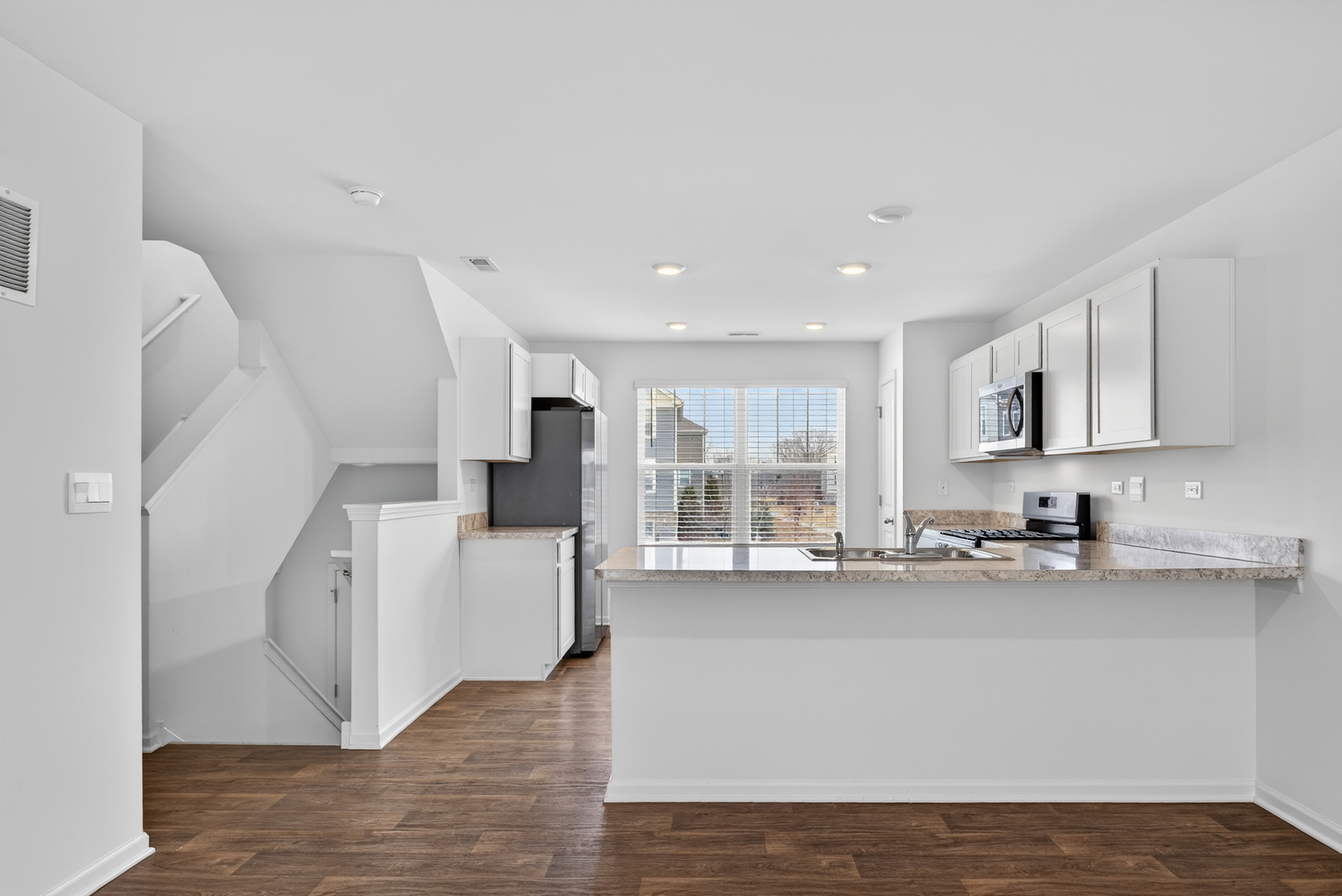 3831 Currant Lane Elgin, IL 60124 - Photo 8 of 25 a view of a kitchen with furniture and wooden floor