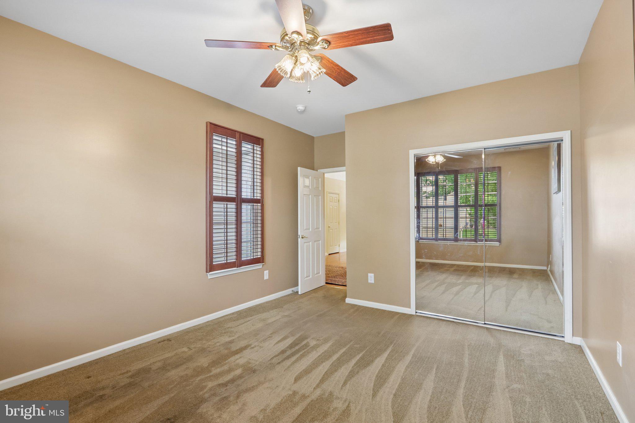 39 Danbury Road Swedesboro, NJ 08085 - Photo 21 of 62 an empty room with chandelier fan and windows